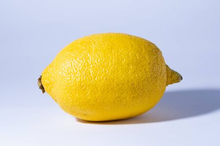 One lemon isolated on white background. Tropical fruit. Flat lay, top view.の写真素材