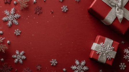 Antiqued holiday composition with textured red fabric and aged golden decorations.