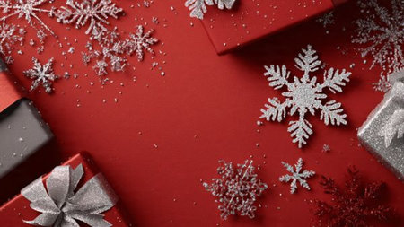 Red-dominated holiday look touched with small gold accents and modern gifting.の写真素材