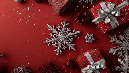 Clean commercial-style frame with Christmas ornaments outlining an empty center space ideal for product or text placement.の写真素材