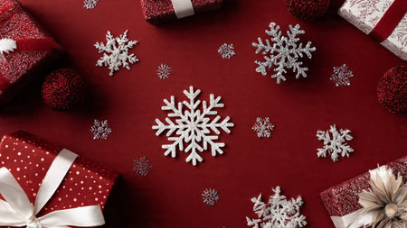 Calm holiday design with soft-focus decorations and muted red tones.