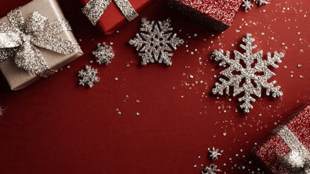 Matte red overhead scene adorned with glittering snow designs.の写真素材