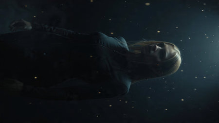 Premium metallic gold arcs glowing across black gradient.の写真素材