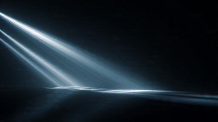 abstract scene with light rays and smoke from the stage on black backgroundの写真素材