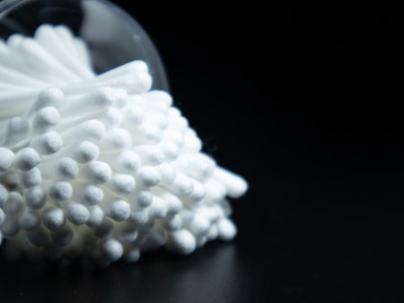 Cotton buds isolated on the black background.