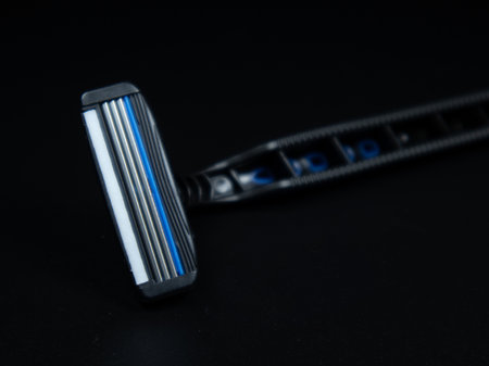 Razor blade closeup on the black background.の写真素材