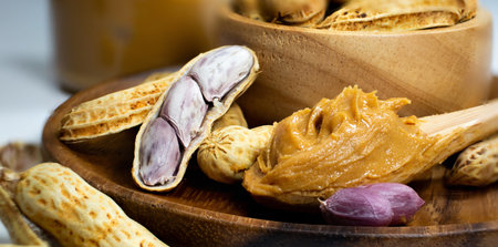 Peanut butter serve 1 scoop with fresh peanuts, prepare for breakfast, Macro view.の写真素材