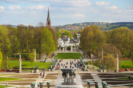 The beautiful and artistic Vigelands park in Oslo, with parts of the city being seen in the background.のeditorial素材