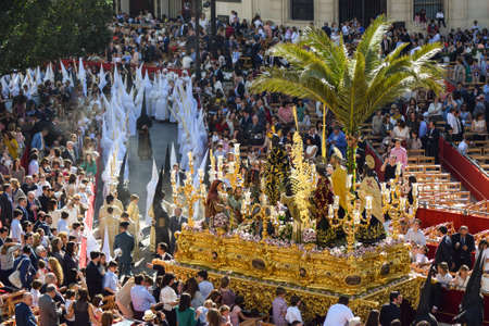 A large group of traditionally dressed up Nazarenes are leading the Easter processions, and the...