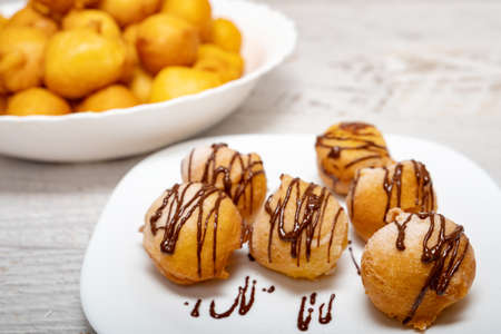 Small dessert donuts with chocolate frosting の写真素材