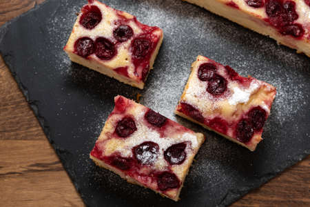 Sliced homemade apple and cherry cakeの写真素材