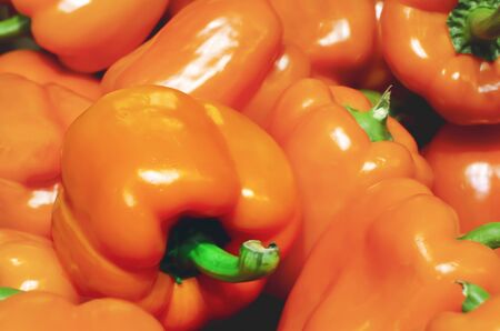 peppers or bell peppers piled up for retail sale in a market