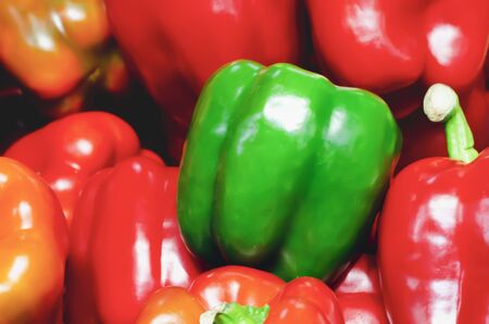 peppers or bell peppers piled up for retail sale in a marketの写真素材