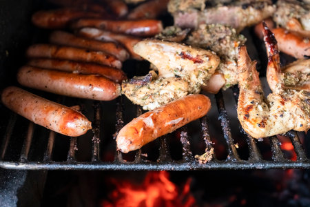 Traditional barbecue ( BBQ) on a brick and charcoal grill, with a variety of meats - pork, chicken...