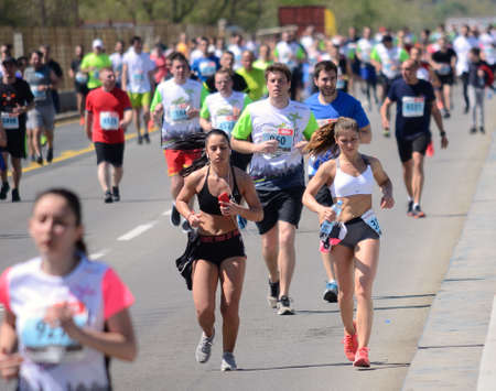 BELGRADE, SERBIA - APRIL 21: A group of marathon competitors during the 31st Belgrade Marathon on April 21, 2018 in Belgrade, Serbiaのeditorial素材