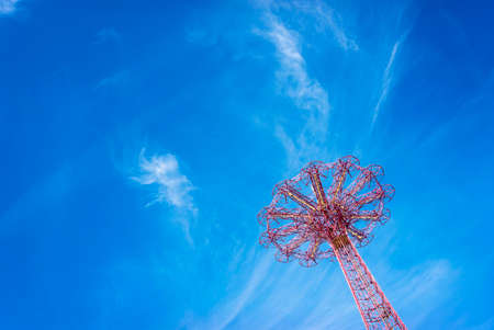 Giant ferris wheel against blue sky and white cloud with copy spaceの写真素材