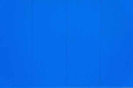 Blue Industrial Metal Panel Wall Backgroundの写真素材