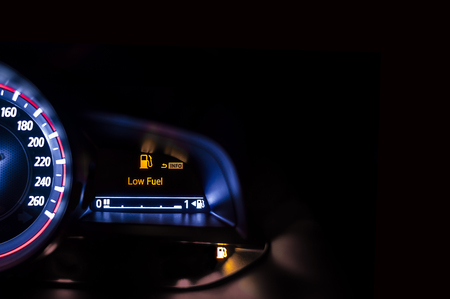 Car speedometer with information display - Low Fuel Warningの写真素材