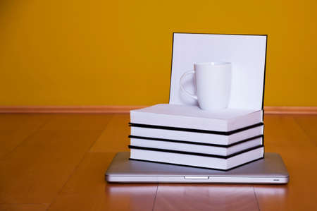 Back to school concept, laptop books coffee mug on wooden floorの写真素材