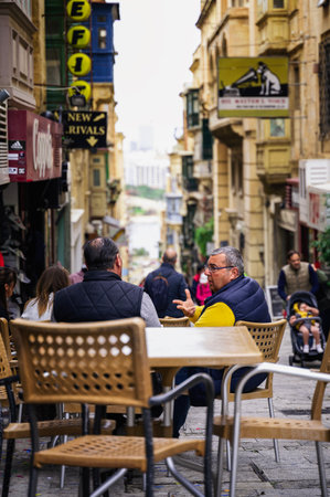 VALLETTA, MALTA - FEBRUARY 2023: Scene on streets of People in Valletta Malta durnig Winter Time, Off Season but Sunny Weather and Beautiful Day for Outdoor Activities, City Explorationのeditorial素材