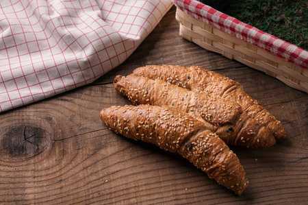 Tasty, freshly baked croissants, whole grain pastry with olives for breakfastの写真素材