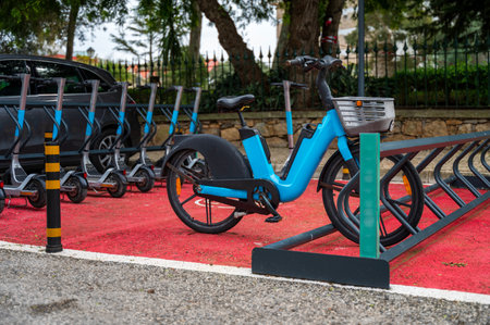 Urban electric bikes charging batteries in the city to rent. Electric Bicycle sharing Service....