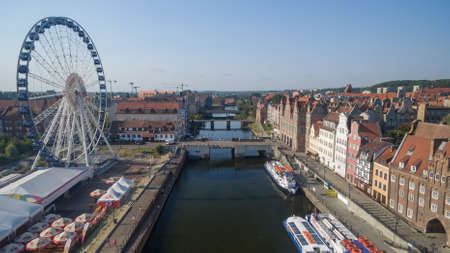 Beautiful scenery of the old town in Gdansk over Motlawa river at dawn, Poland.