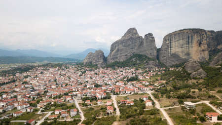 Kalampaka town with Meteora cliffs and monasteries, Greece.