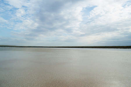 Crystals of natural salt in the lifeless hot terrain on the salt lake Baskunchak. Russia. Astrakhan...