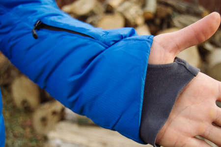 Male model in winter blue jacket posing