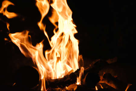 Fire in the fireplace, note shallow depth of field.close up image of fireplace and wood burningの写真素材