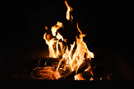 Fire in the fireplace, note shallow depth of field.close up image of fireplace and wood burningの写真素材