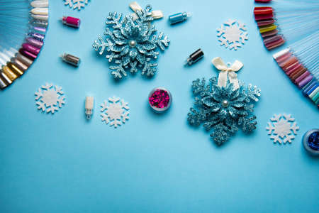Beauty accessories for manicure and pedicure on a blue christmas background,. Samples of nail...