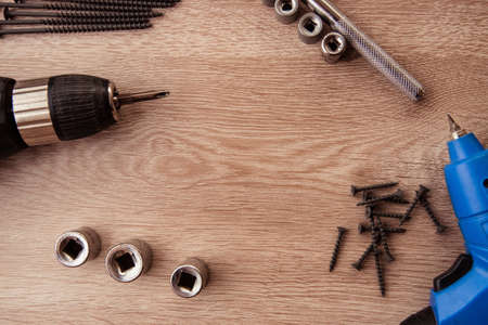 Construction tooling on wooden background ,copy space, maintenance concept.