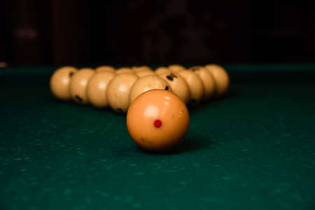 pyramid of billiard balls on the billiard table close up. Billiard balls pool in triangle on green tableの写真素材
