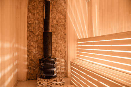 sauna bathhouse warm interior inside empty brooms barrels bucket for water.Sauna interior comfortable wooden room spa indoorsの写真素材