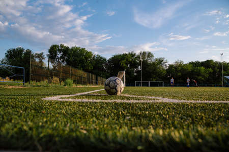 Soccer player kicks the ball.Soccer player takes a corner kick.Football player kicks the ball on the football field.Football sports conceptの写真素材