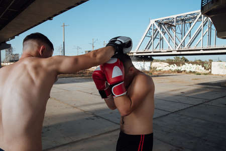 boxing sparring. Two boxers fight with gloves during a boxing match.の写真素材