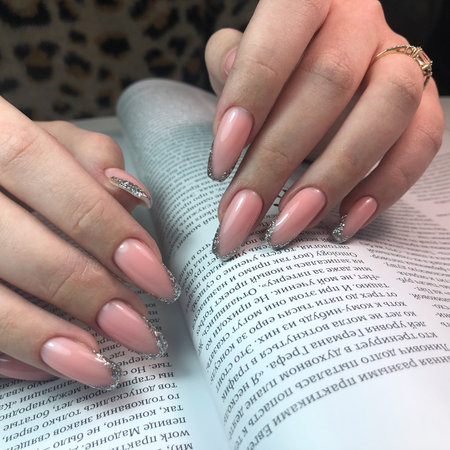 French manicure on the nails.Manicure gel nail polish. Spa and Manicure concept. Female hands with french manicure.のeditorial素材