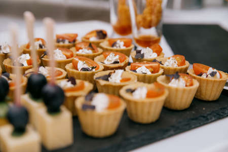 Delicacies and snacks at the buffet or banquet. Catering.snacks on the table at the holiday. banquet snacks. canapes. cateringの写真素材