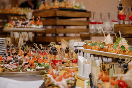 Delicacies and snacks at the buffet or banquet. Catering.snacks on the table at the holiday. banquet snacks. canapes. cateringの写真素材
