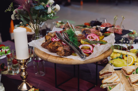 Juicy tasty grilled meat with fresh vegetables.Traditional Russian shashlik with onion, lavash and sauce on wooden board.の写真素材