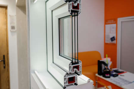 Section of window profile with metal, glass and insulation.Window profile cut of with metal, glass and insulationの写真素材