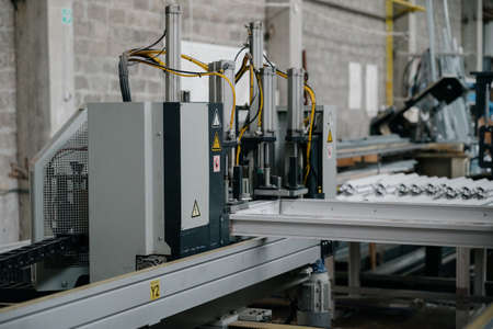Factory for aluminum and PVC windows and doors production. Details industrial equipment.The process...
