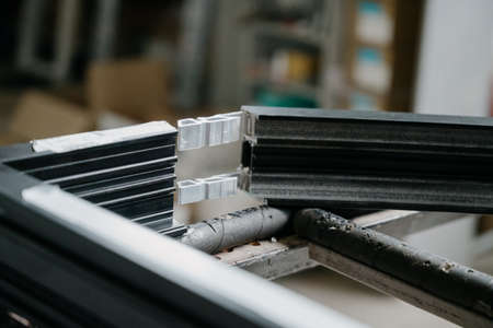 Production and manufacture of window profiles. Plastic and metal profiles close-up.Window...