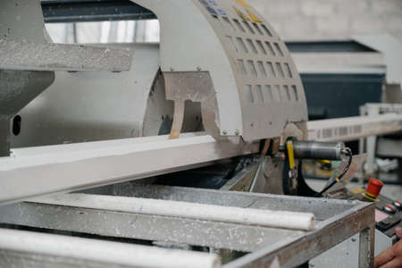 Factory for aluminum and PVC windows and doors production. Details industrial equipment.The process...