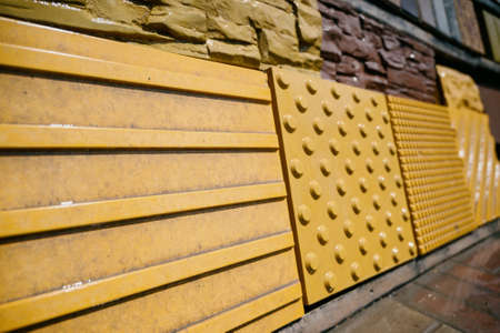 Paving slabs of different colors and shapes.Texture of different colored patterned paving slabs . modern road surface.の写真素材