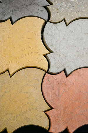 Texture of different colored patterned paving slabs . Modern road surface.Traditional fence, court,...