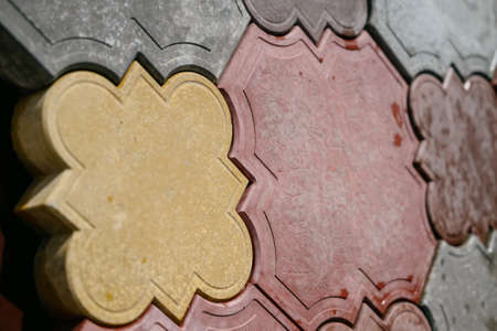 Texture of different colored patterned paving slabs . Modern road surface.Traditional fence, court, backyard or road paving.の写真素材