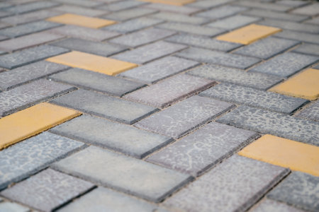 Paving slabs of different colors and shapes.Texture of different colored patterned paving slabs . modern road surface.の写真素材